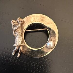vintage gold-tone lady golfer pin with a faux pearl